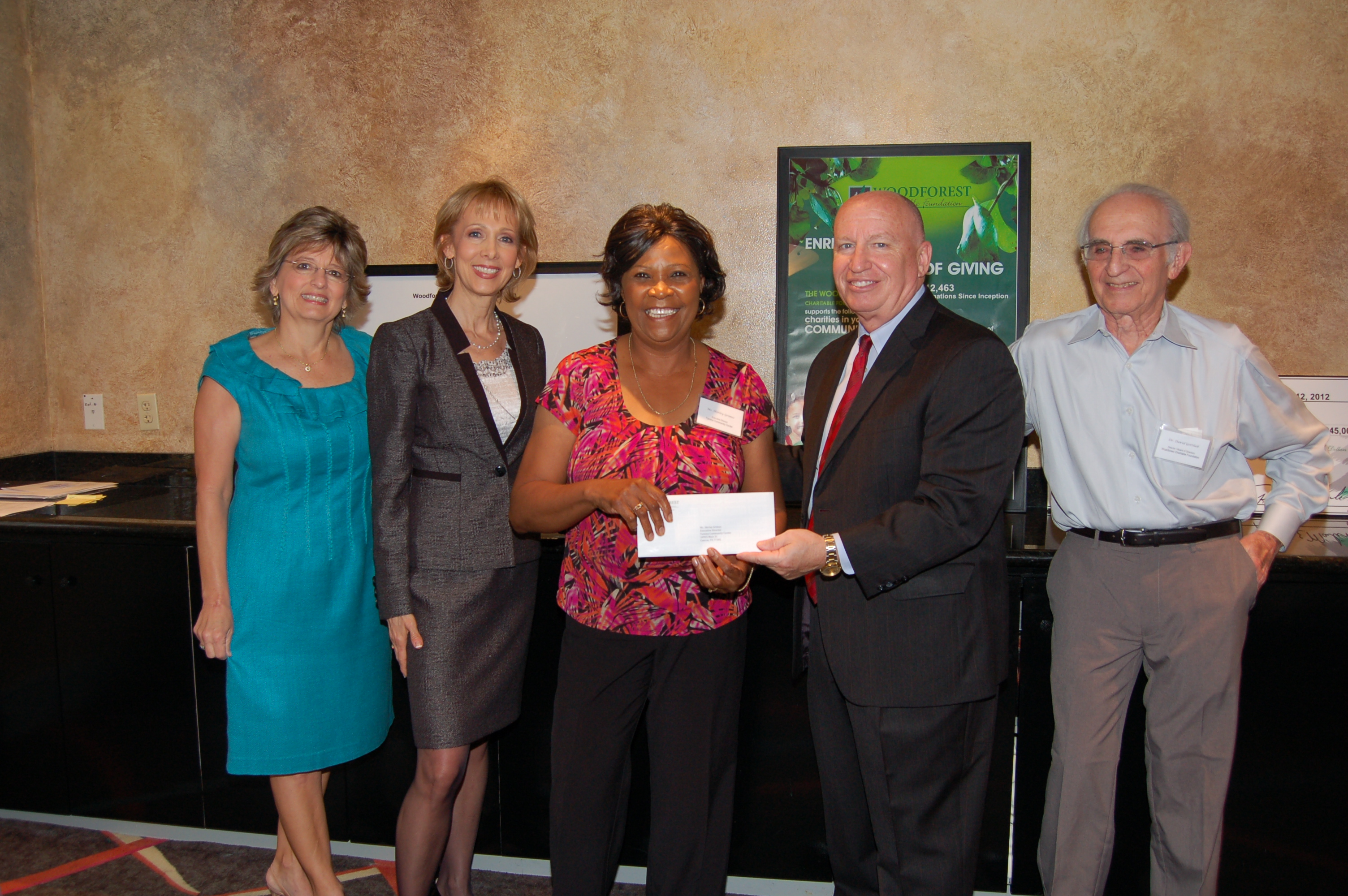 Tamina Community Center receives $5,000 donation from Woodforest Charitable Foundation.